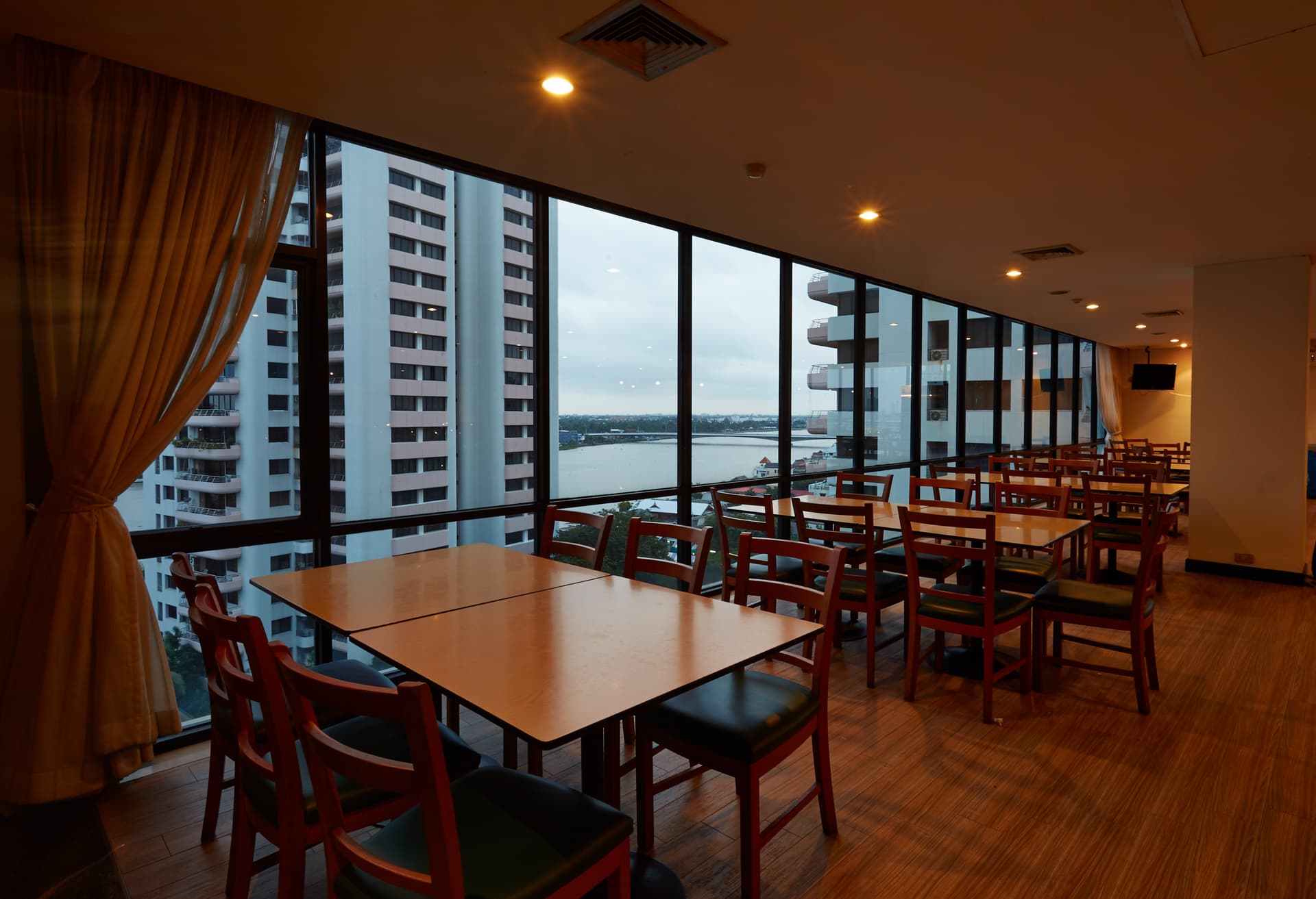 Evening riverside dining at River Cuisine Restaurant, Riverine Place